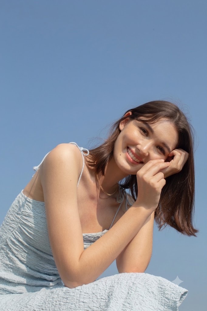 Esther Chipman smiling under a clear blue sky